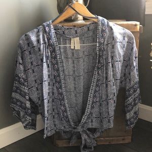 Woman’s size S blue pink floral short sleeve wrap around shirt